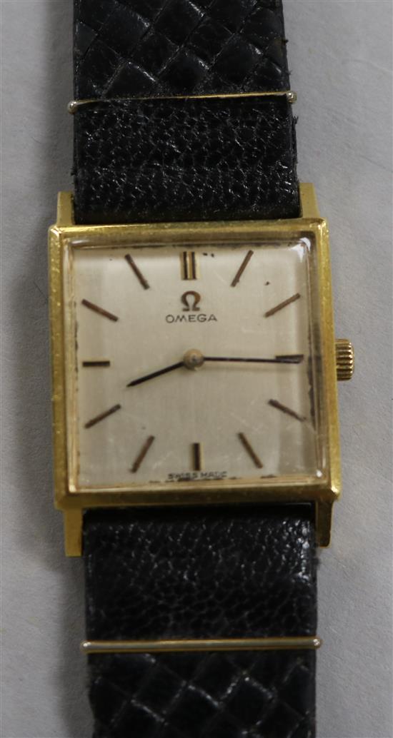 A 18ct gold Omega dress wrist watch with square dial, on leather strap.